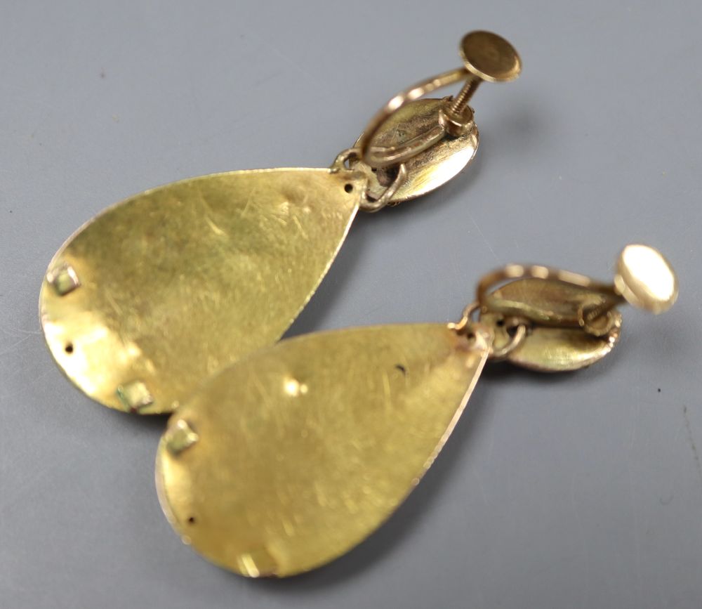 A pair of Victorian yellow metal and garnet set pear shaped drop ear clips, 38mm, gross 5.7 grams.